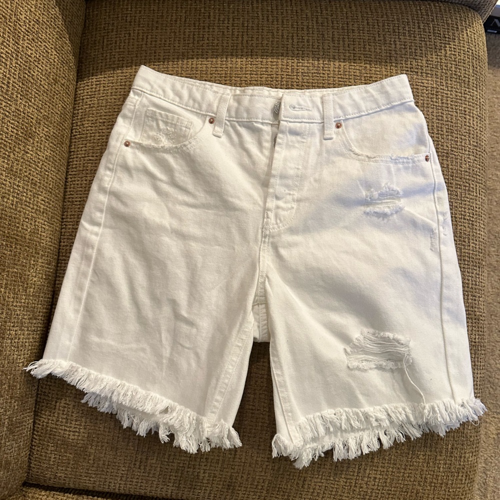 White tattered jean shorts